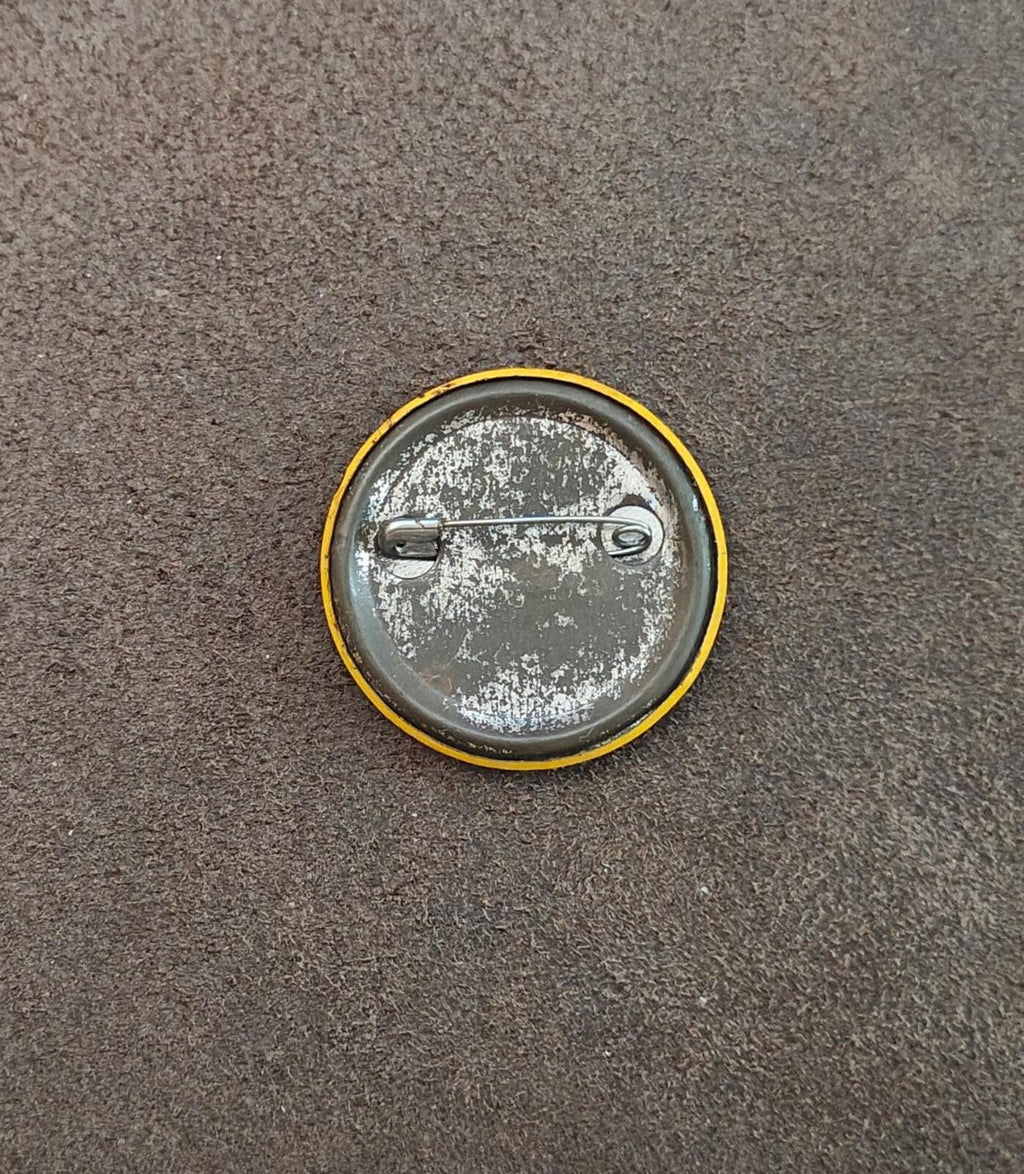 Metal pinback button back with safety pin and worn silver finish