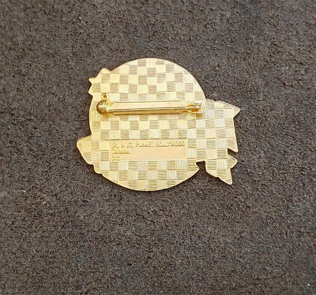 Gold-tone Planet Hollywood Honolulu enamel pin back with checkered pattern and pin post