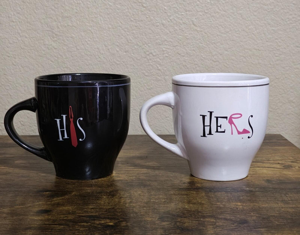 Couple mug set of 2: black HIS and white HERs mugs, front view with handles.