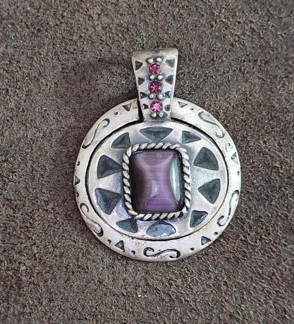 Silver Southwest pendant front with purple center stone and three pink stone rows
