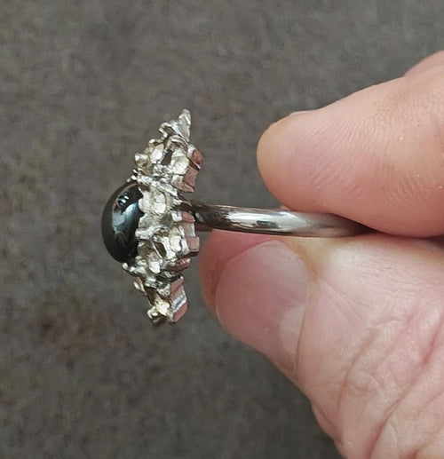 Vintage hematite stone ring with silver tone bezel and prong-set clear accents
