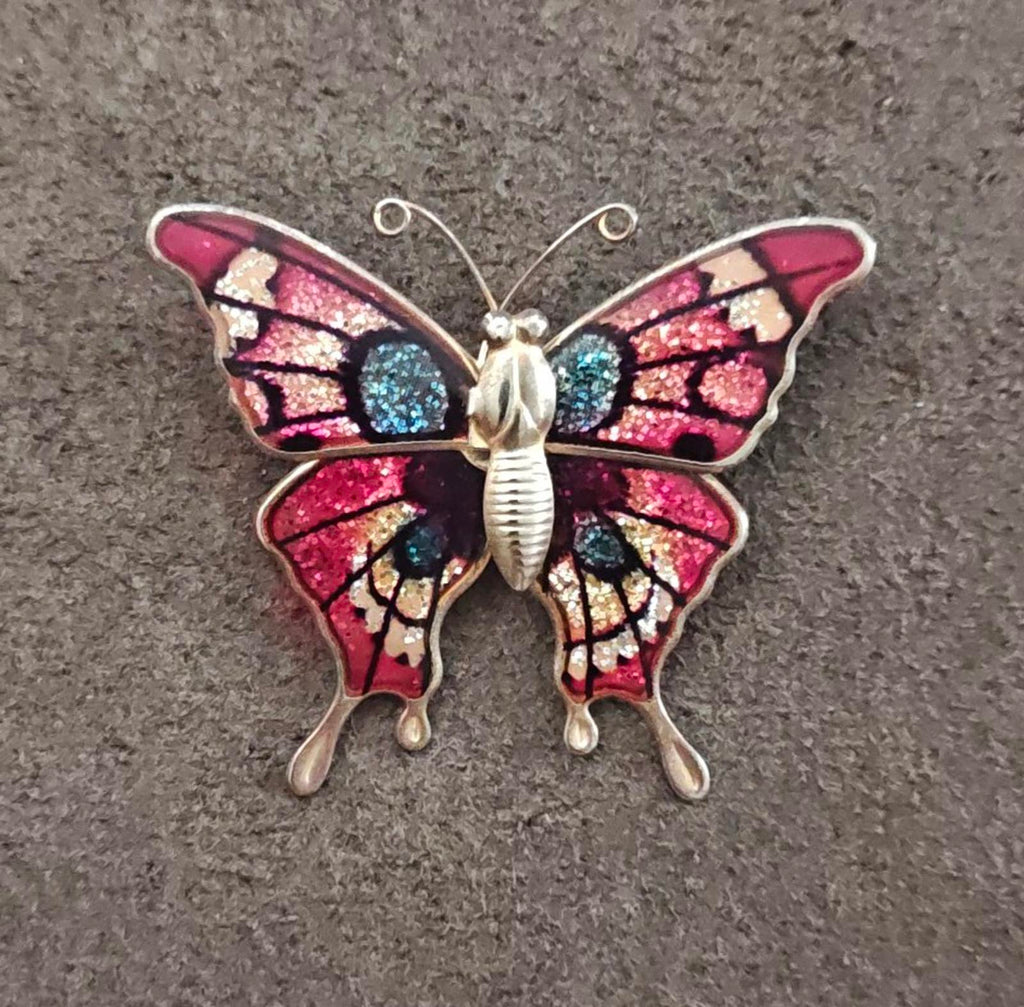 Butterfly brooch with red and blue glitter enamel wings, gold-tone metal body
