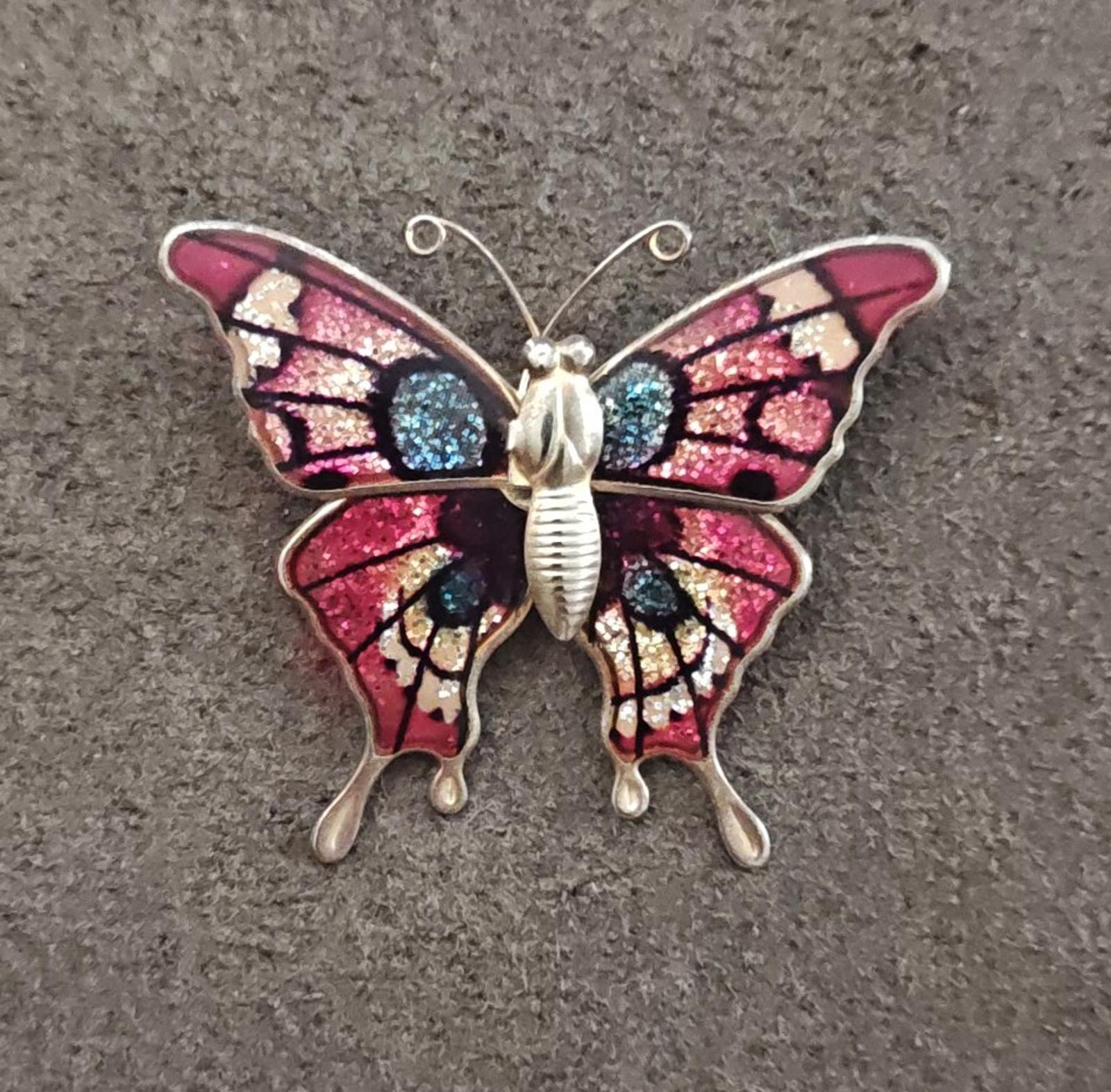 Butterfly brooch with red and blue glitter enamel wings, gold-tone metal body