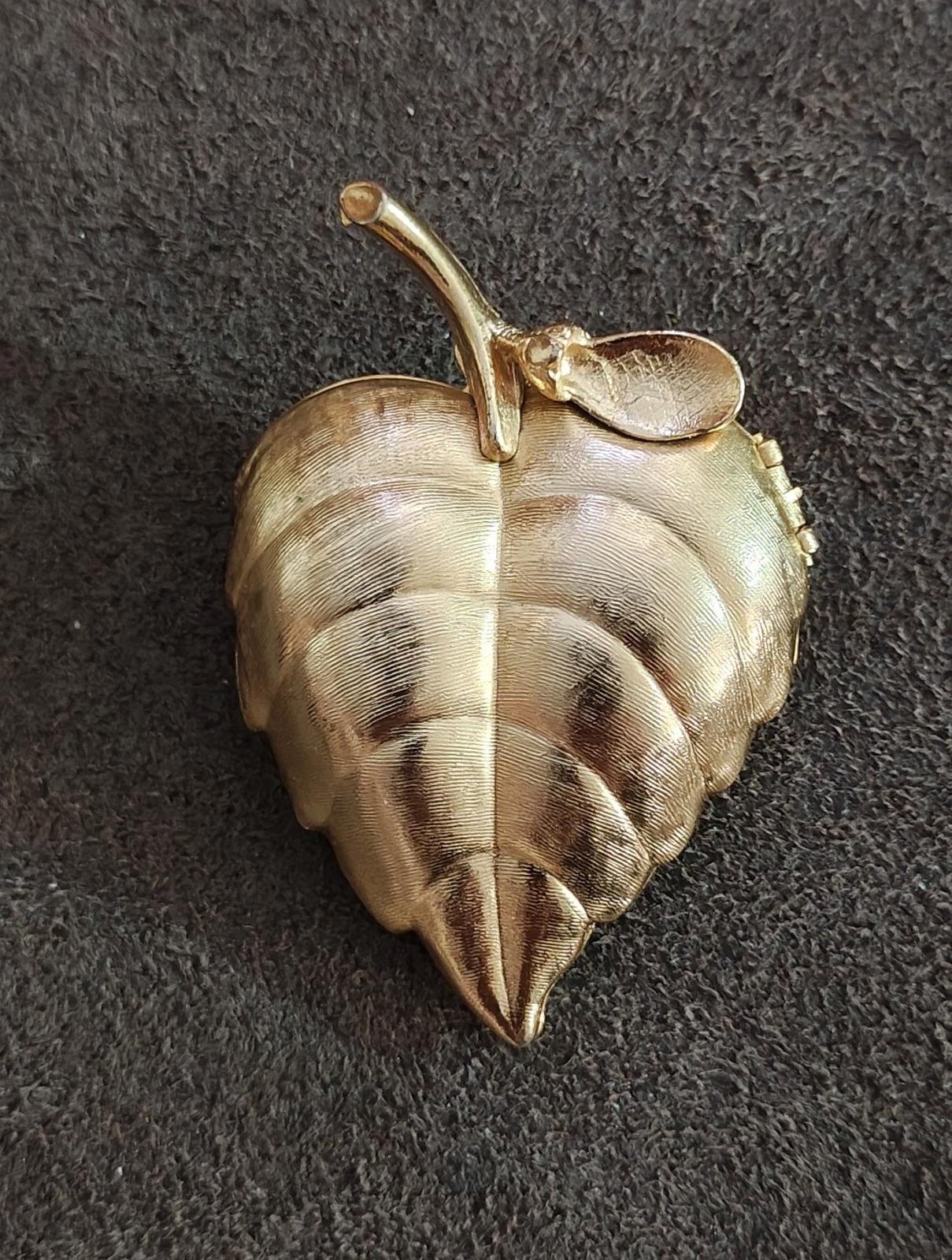 Gold tone leaf-shaped locket brooch, raised leaf vein texture and small top ring