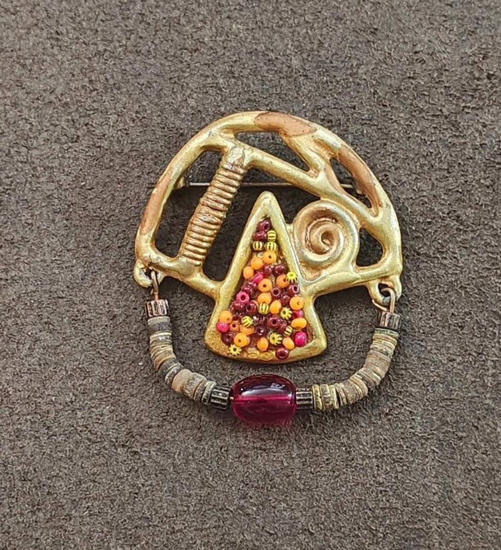 Gold-tone abstract brooch, heishi bead circle, spiral motif, multicolor triangle panel