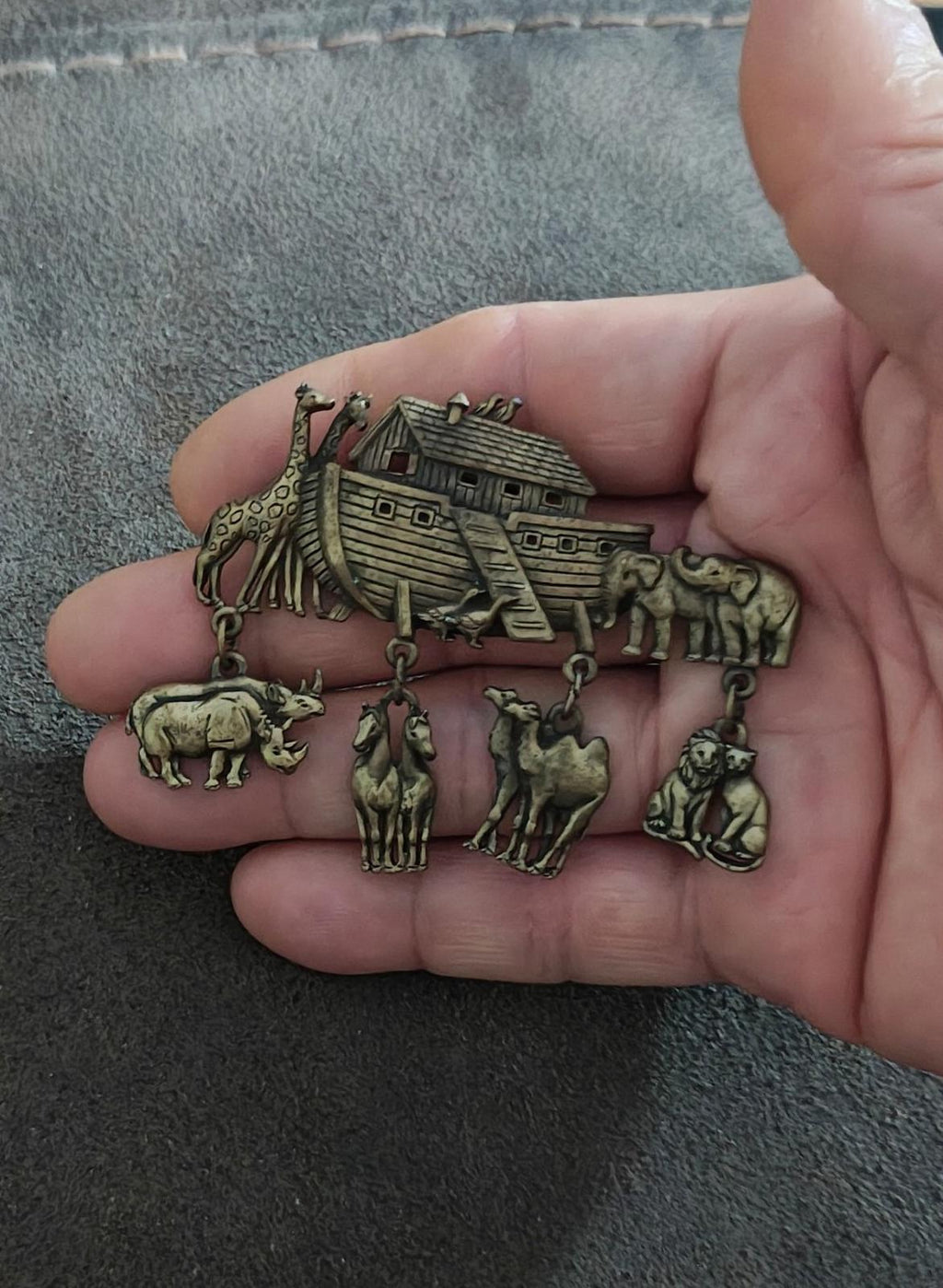 Gold Noah’s Ark brooch pin with ark centerpiece and dangling safari animal charms