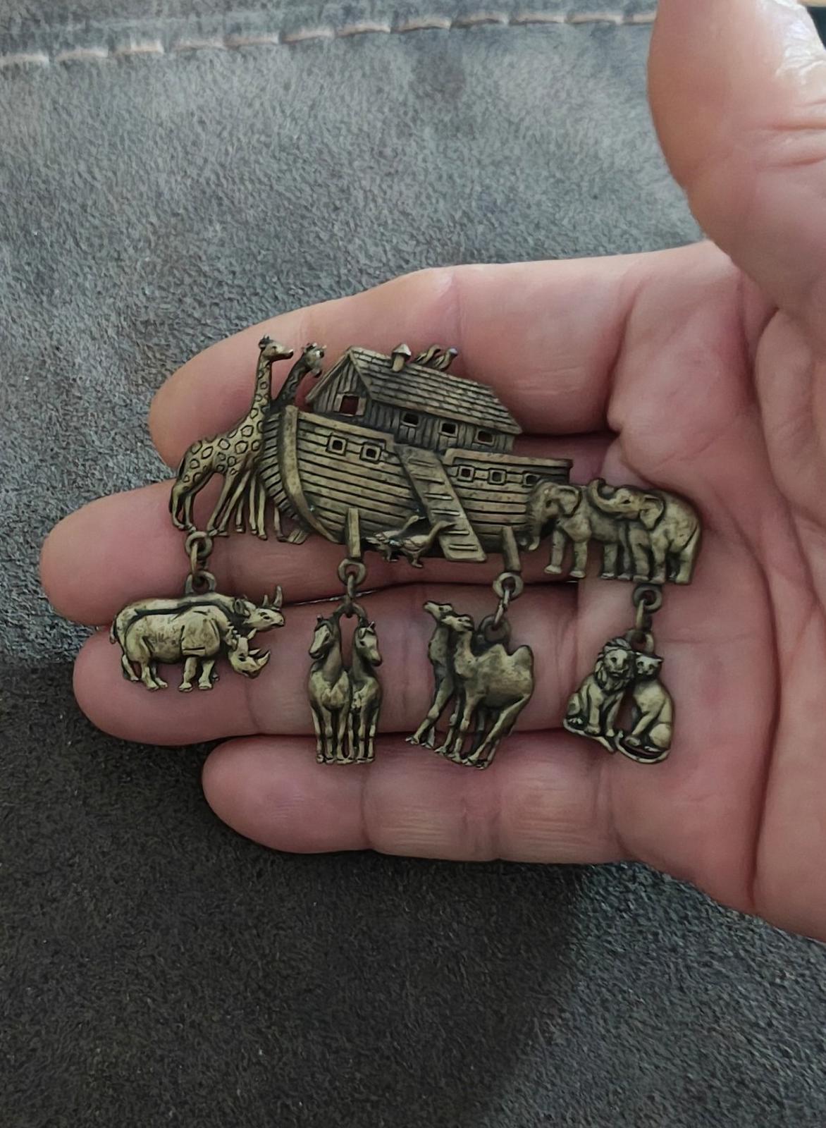 Gold Noah’s Ark brooch pin with ark centerpiece and dangling safari animal charms