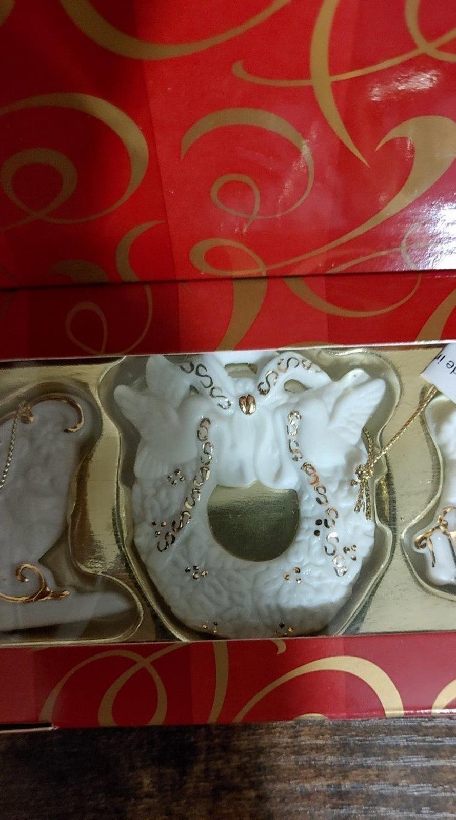 Bisque porcelain ornament center wreath design with gold accents in red gift box
