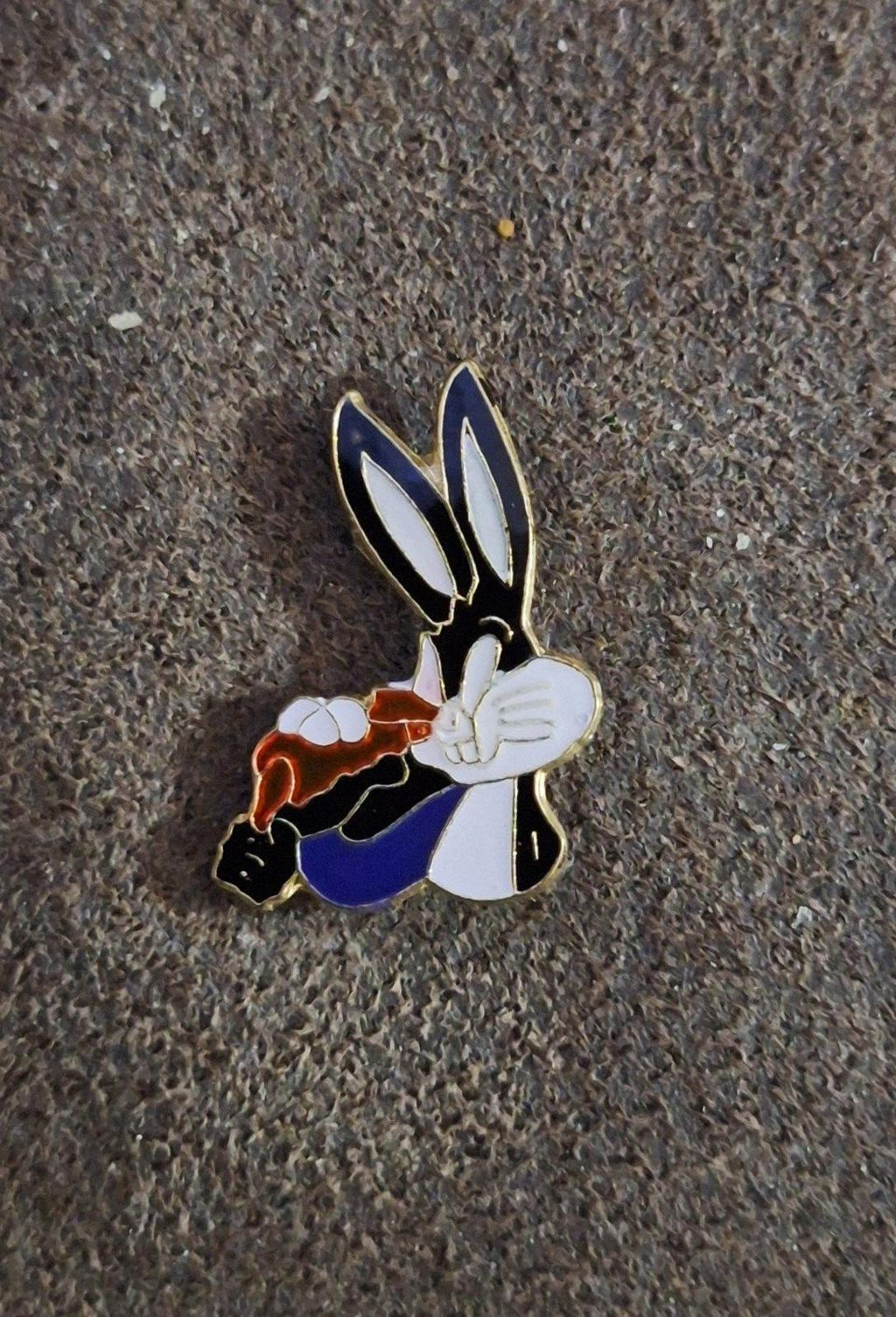 Bugs Bunny enamel pin holding a carrot, full figure with black ears and blue suit