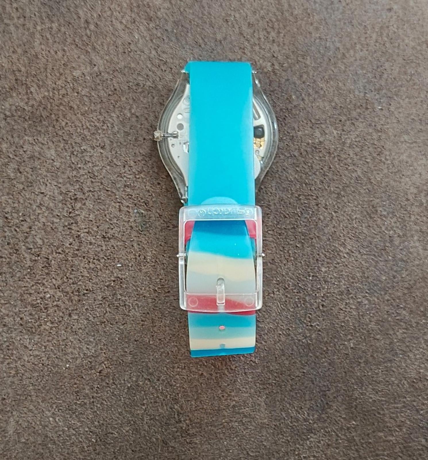 Unisex wristwatch back with metal clasp and turquoise blue silicone strap