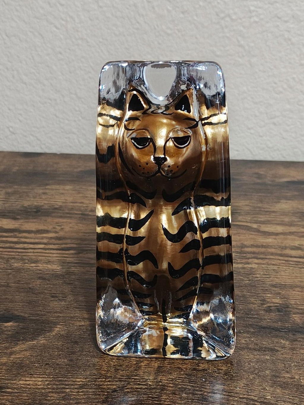 Clear cat paperweight figurine front view with closed eyes and tabby stripes