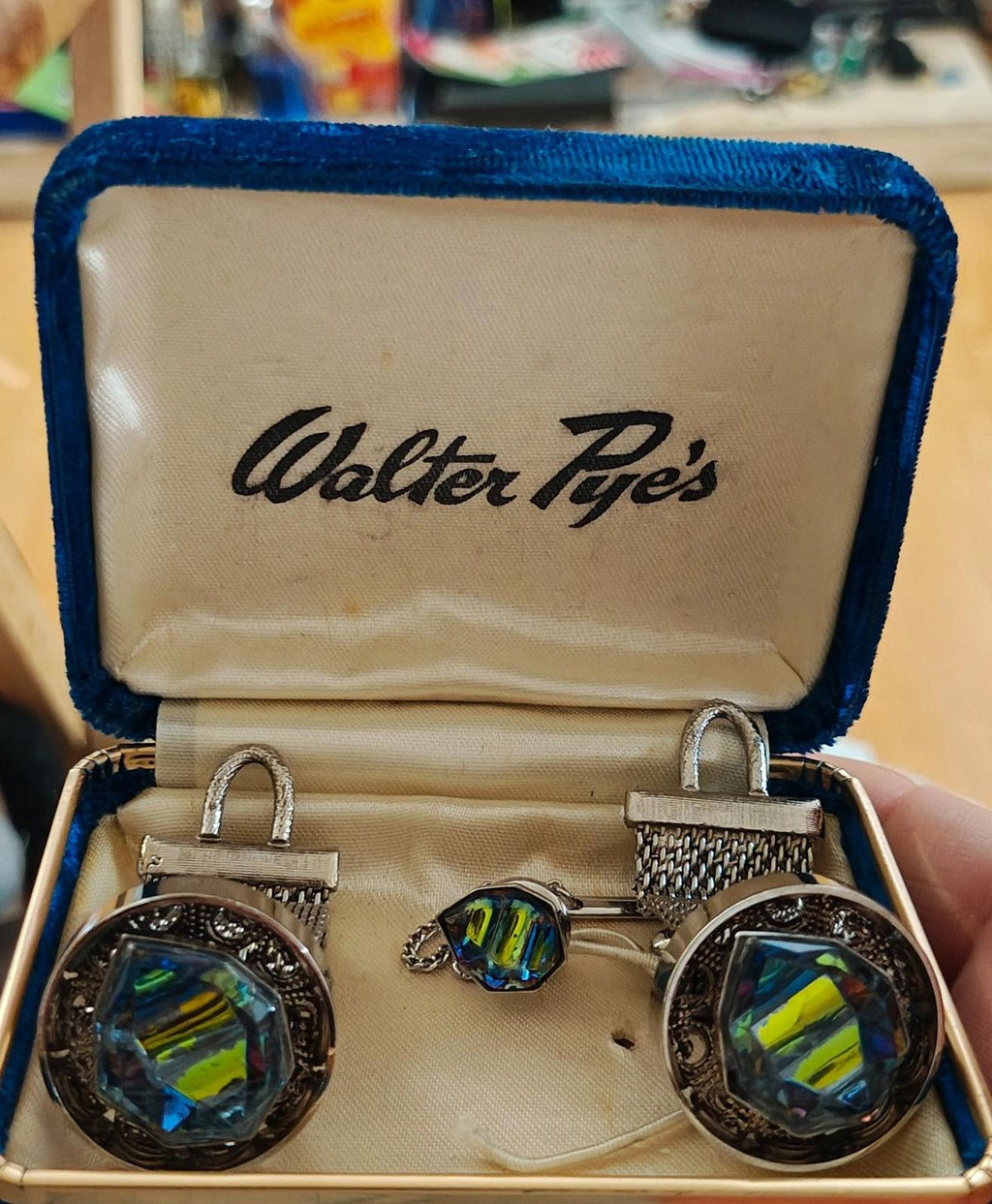 Iridescent gemstone-style cufflinks with tie tack in Walter Pye's blue velvet box