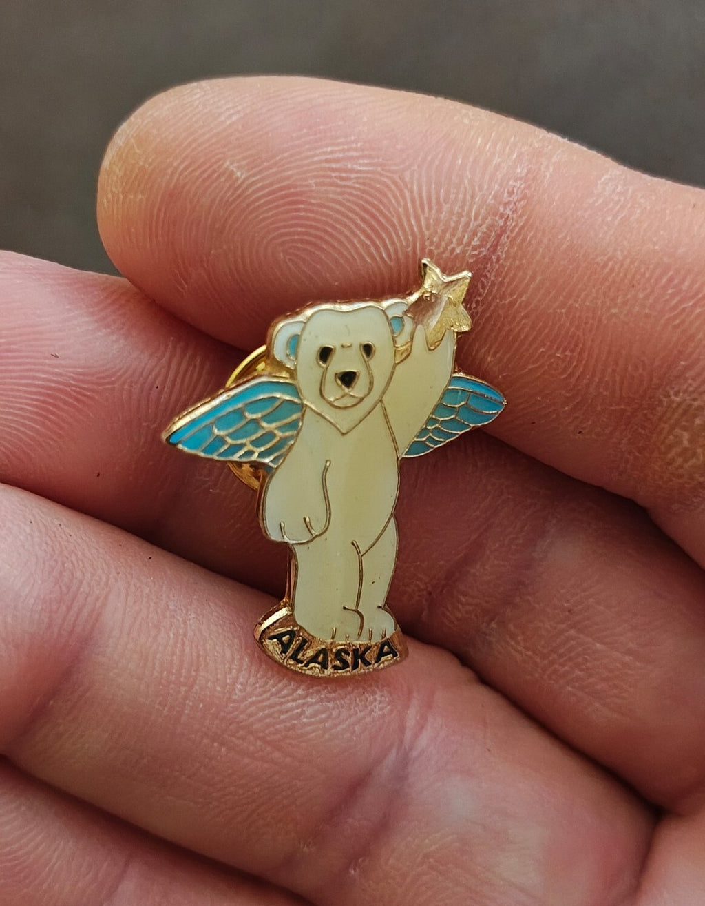 1980s Alaskan Polar Bear Guardian Angel Gold Tone Enamel Pin.
