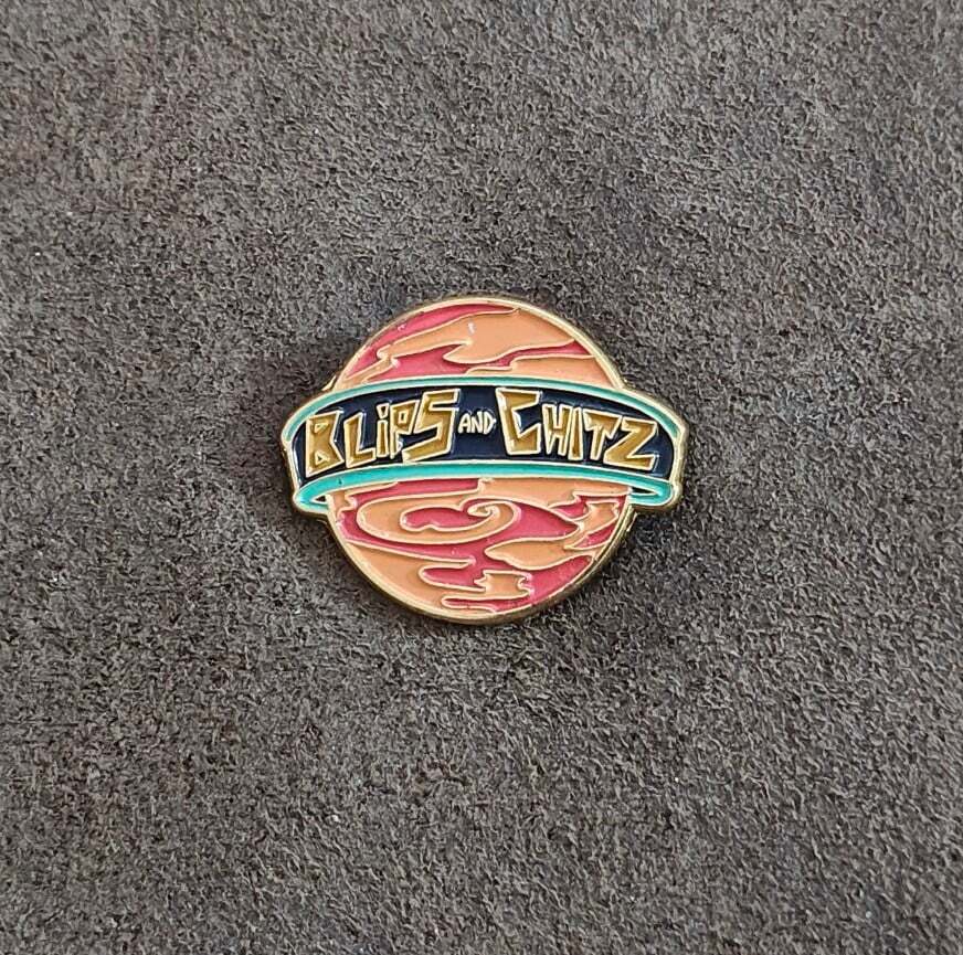 Funko Rick & Morty Blips & Chitz Exclusive Gold Tone Orange Enamel Pin.