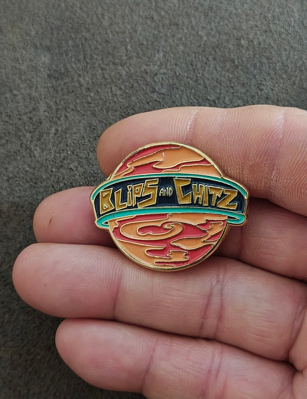 Funko Rick & Morty Blips & Chitz Exclusive Gold Tone Orange Enamel Pin.