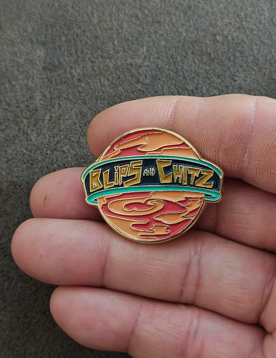 Funko Rick & Morty Blips & Chitz Exclusive Gold Tone Orange Enamel Pin.