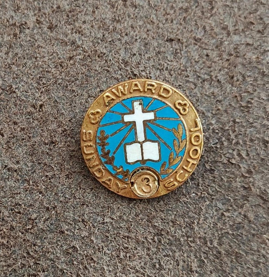 Vintage gold-tone attendance award pin with blue enamel cross, laurel, and "3" number