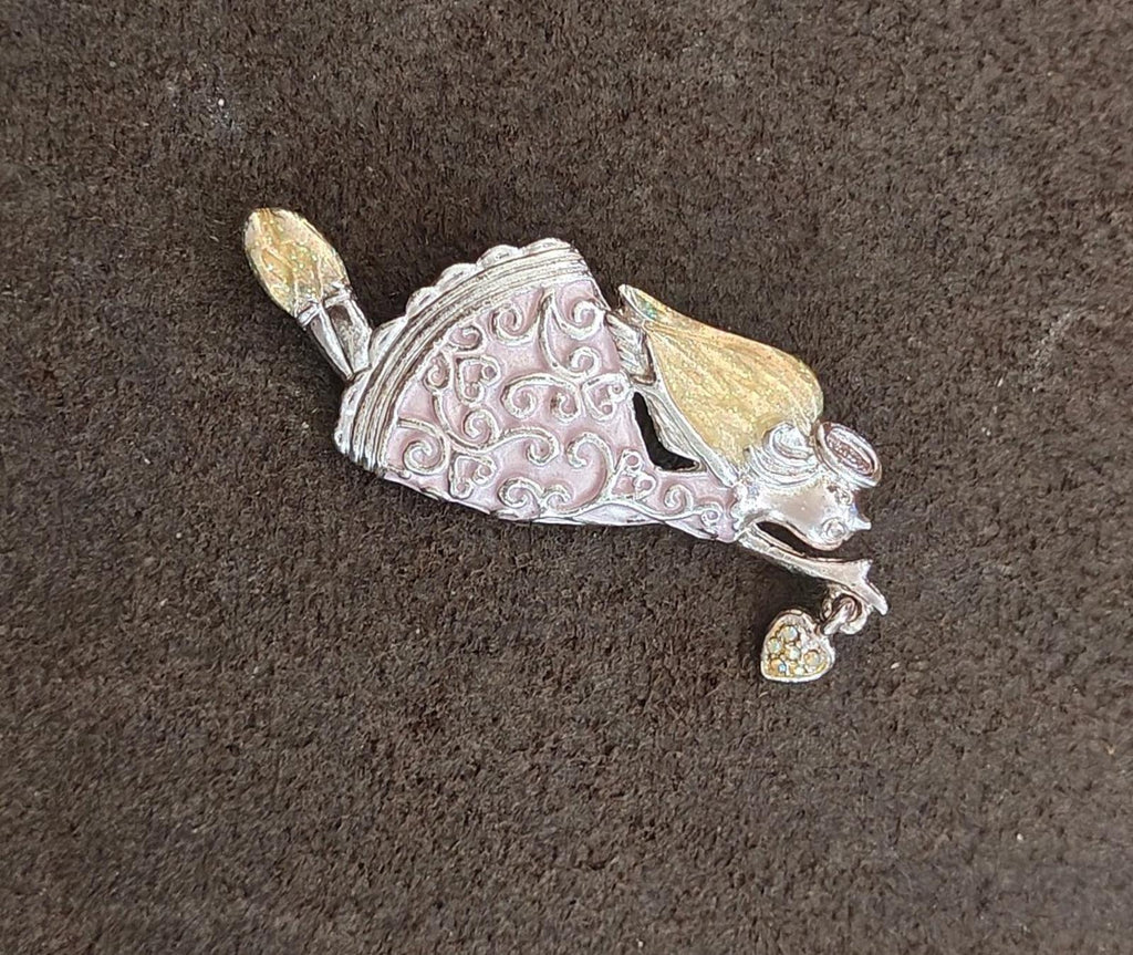 Silver-tone angel brooch pin with raised filigree pattern and yellow enamel accents