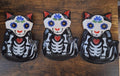 Set of three black 3D cat sugar skull trinket plates with blue and red face details