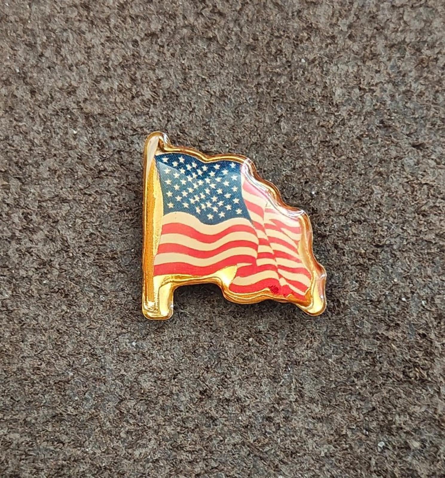 Gold-tone United States flag pin, enamel stars and stripes with raised outline