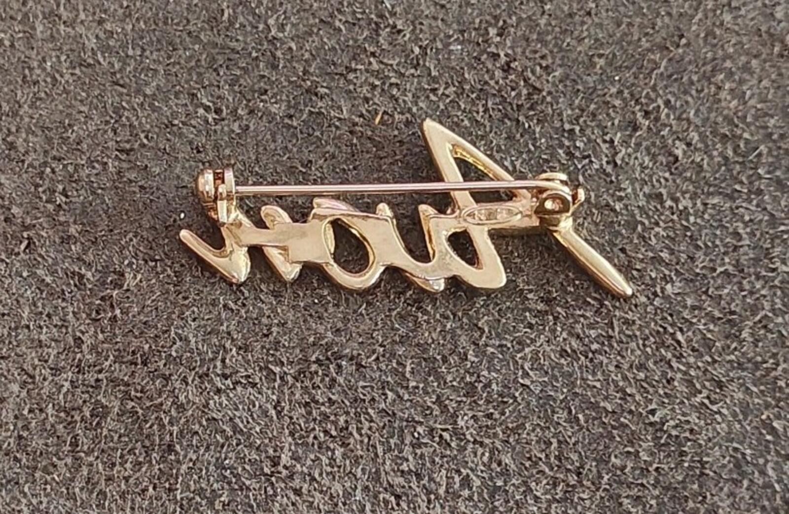 1980s/90s  Avon Gold Tone Cursive Logo Pin