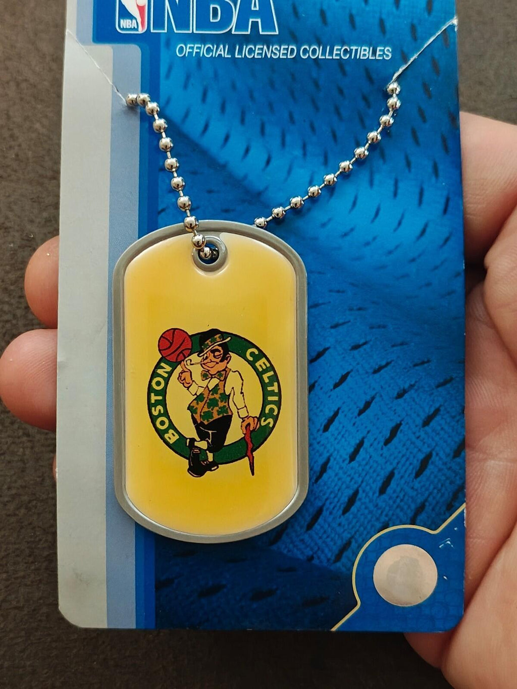 Boston Celtics dog tag necklace with silver chain and yellow enamel logo tag