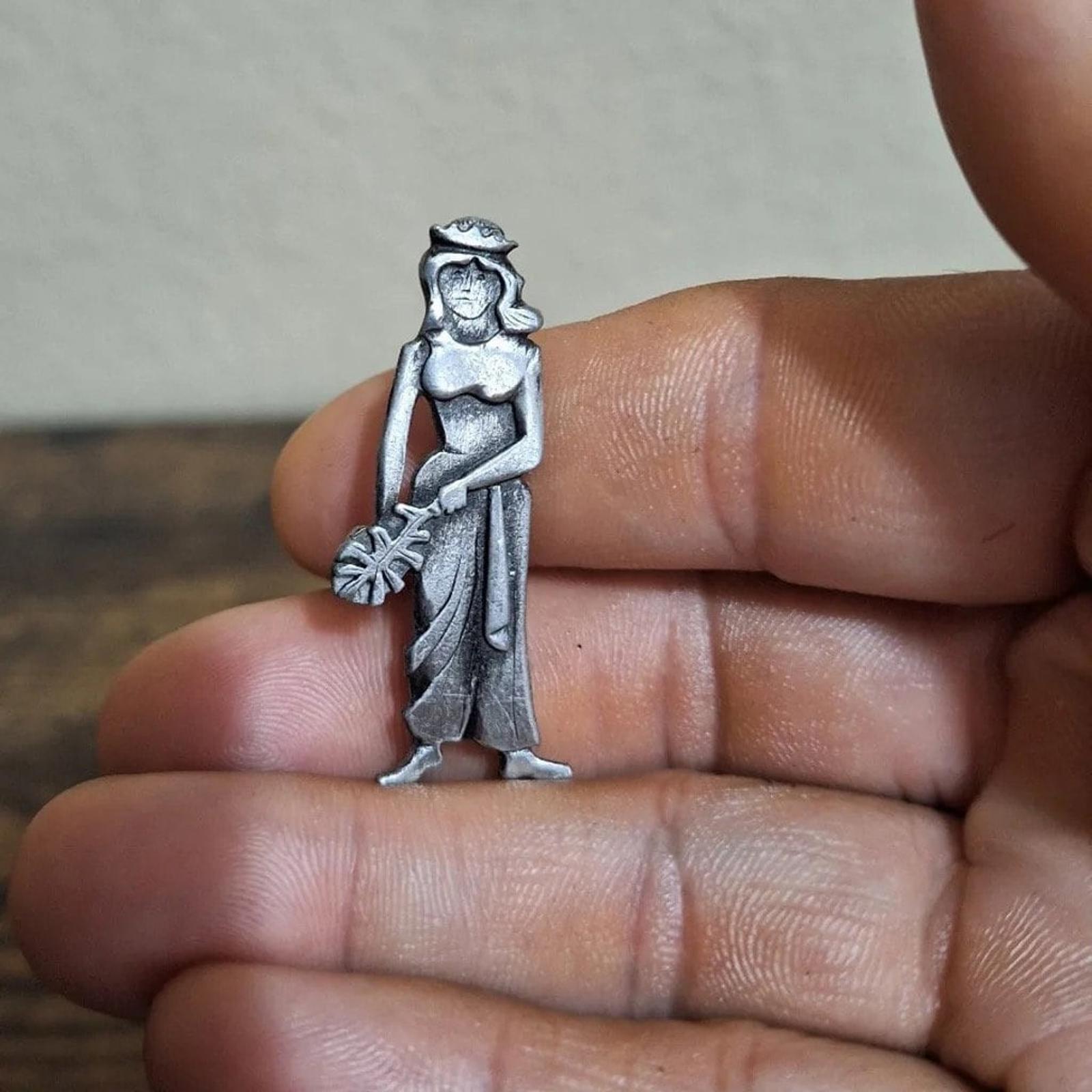 Metzke pewter girl brooch pin, standing figure with floral accent, silver-tone