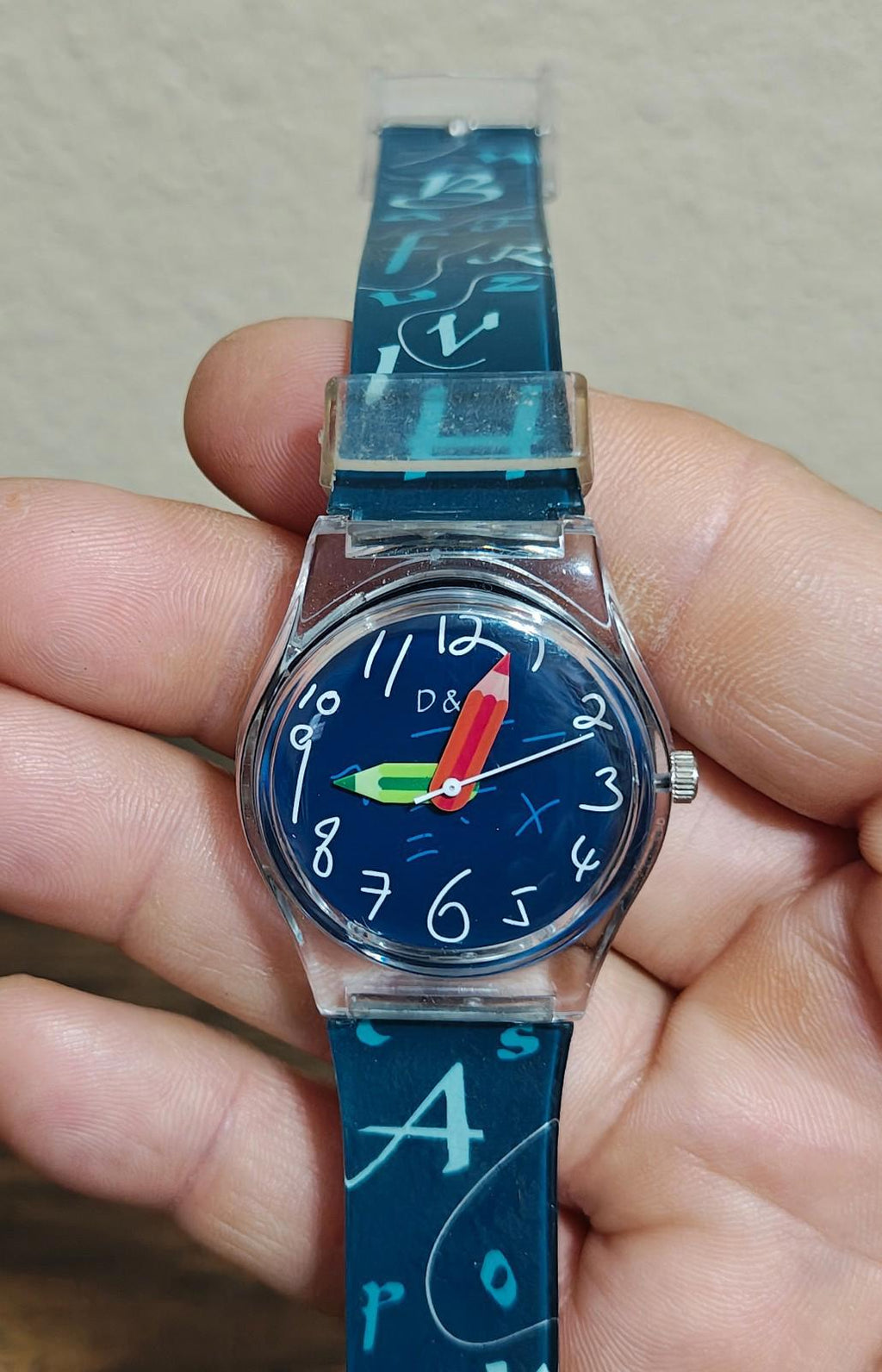 Blue unisex teacher watch with printed strap and round blue dial in silver case
