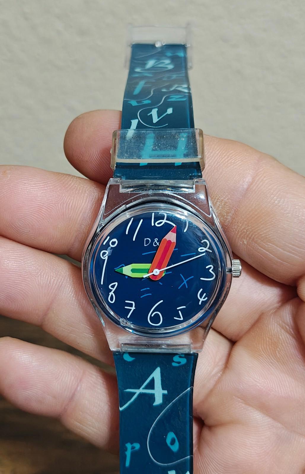Blue unisex teacher watch with printed strap and round blue dial in silver case