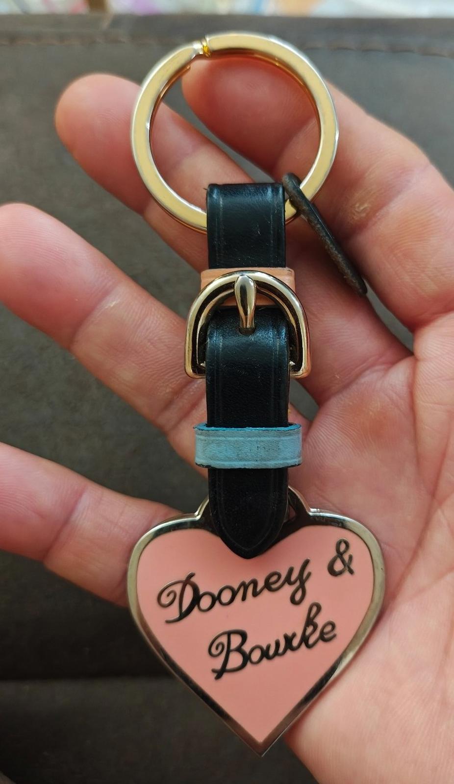 Dooney & Bourke heart keychain fob with black leather strap, light blue accent, gold ring