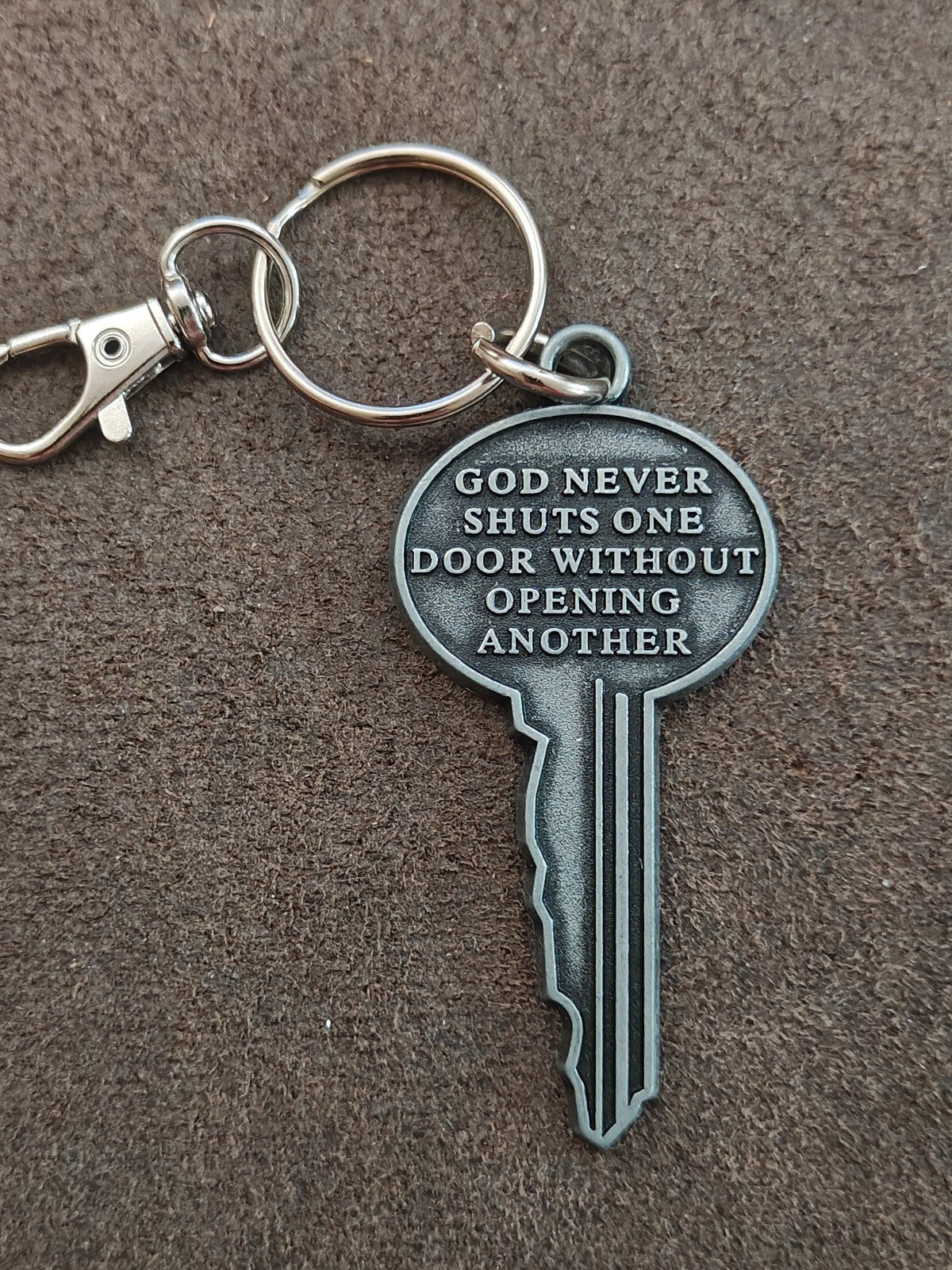 "God never shuts one door without opening another." Cast Metal Keychain
