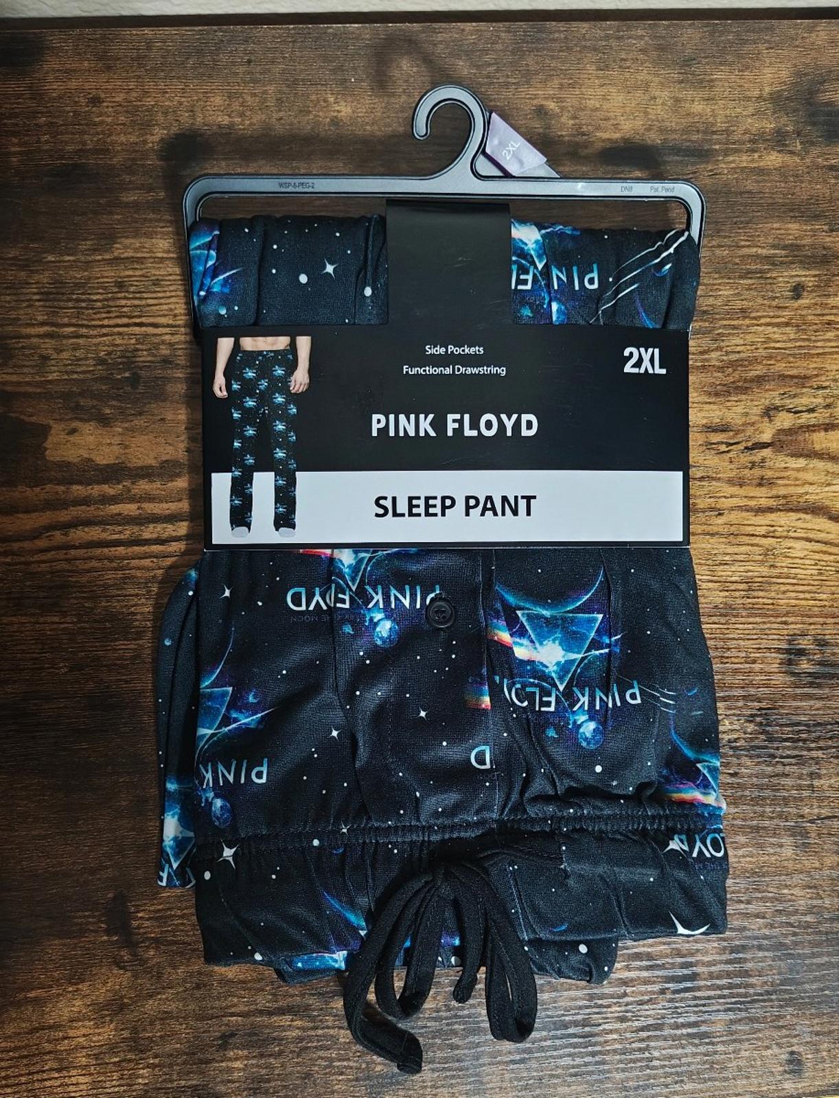 Black graphic sleep pants with drawstring, starry blue print and large logo text