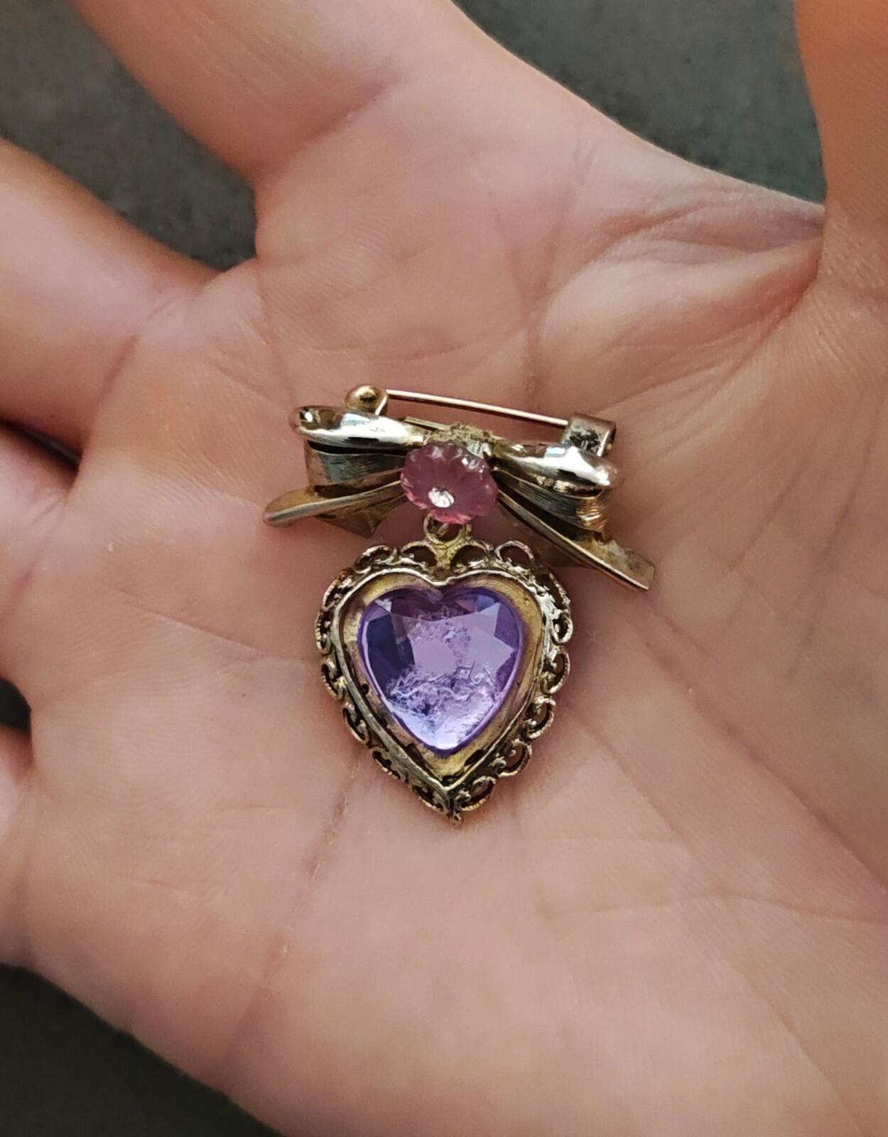 1980s Gold Tone Bow With Pink Flower & Filigree Edged Purple Stone Heart Brooch