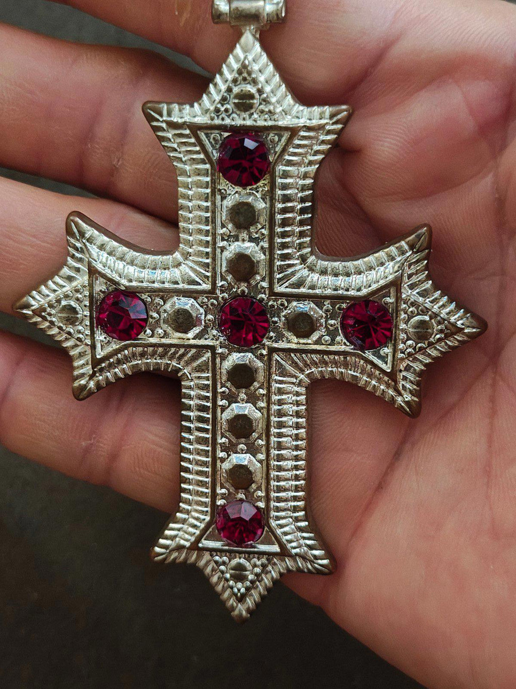 Silver tone gothic cross pendant necklace with red rhinestones and ornate borders