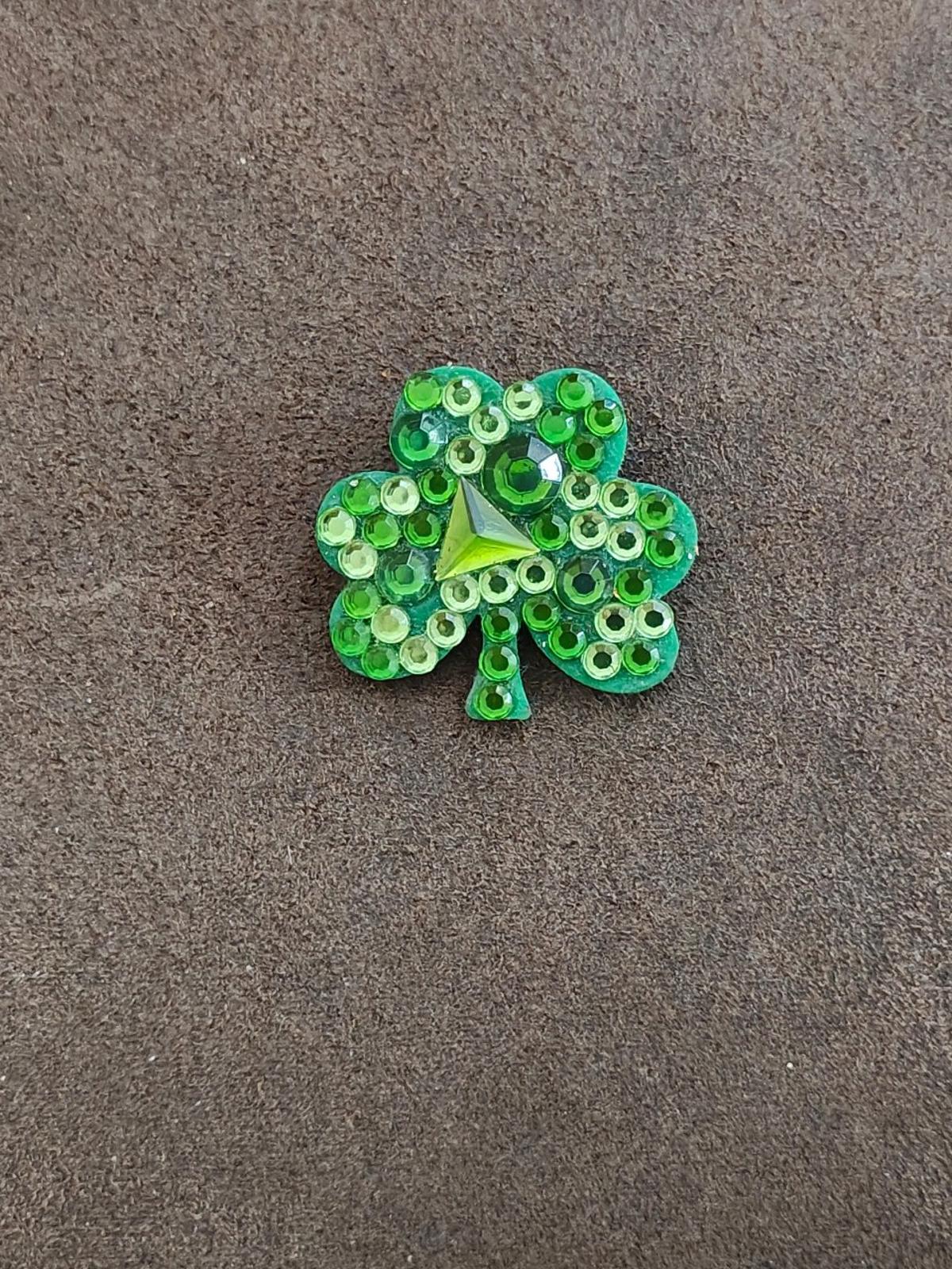 Green rhinestone shamrock brooch pin with sparkling stones and small center star