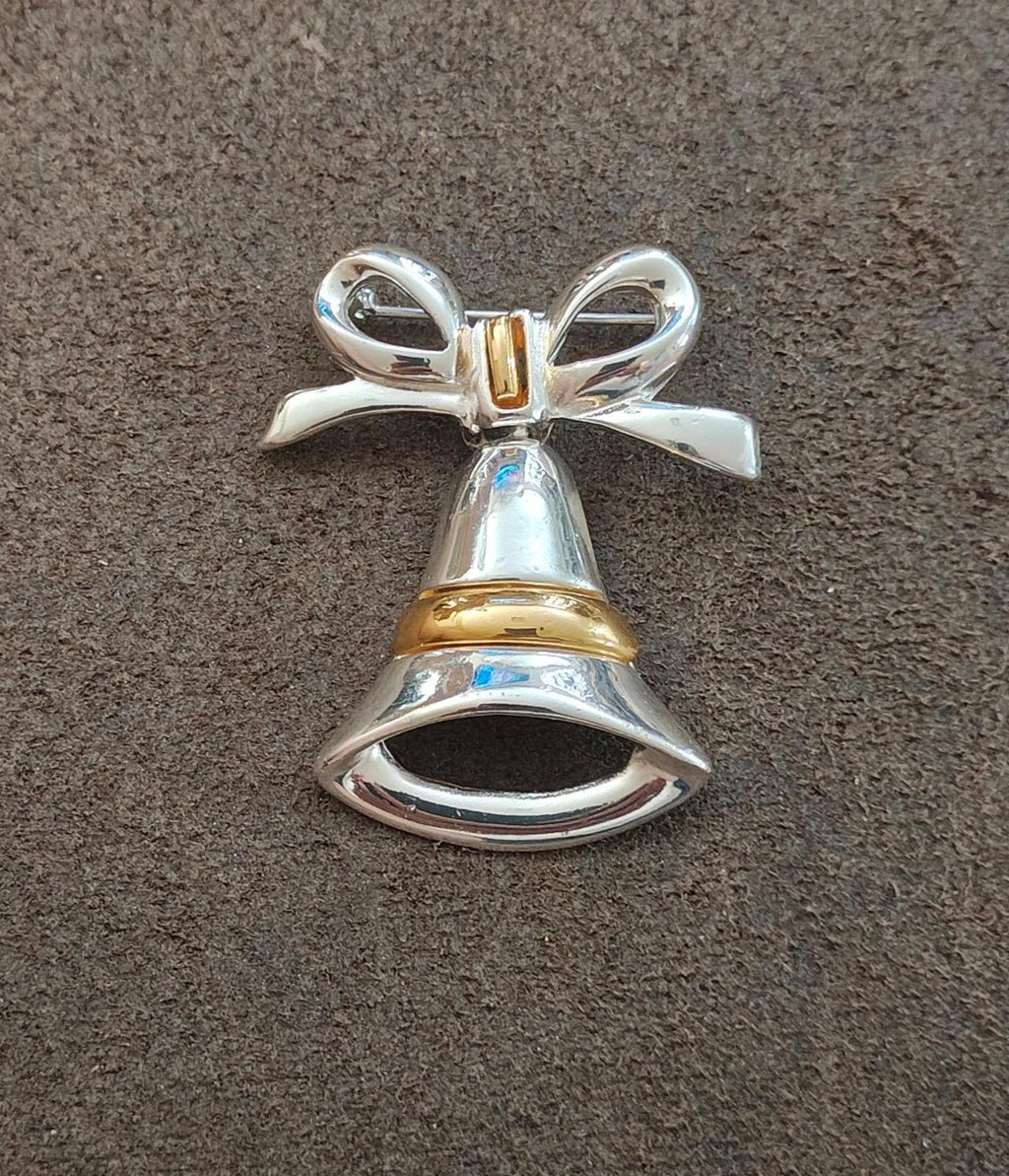 Two-tone Christmas bell bow brooch centered view, silver-tone bell with gold band