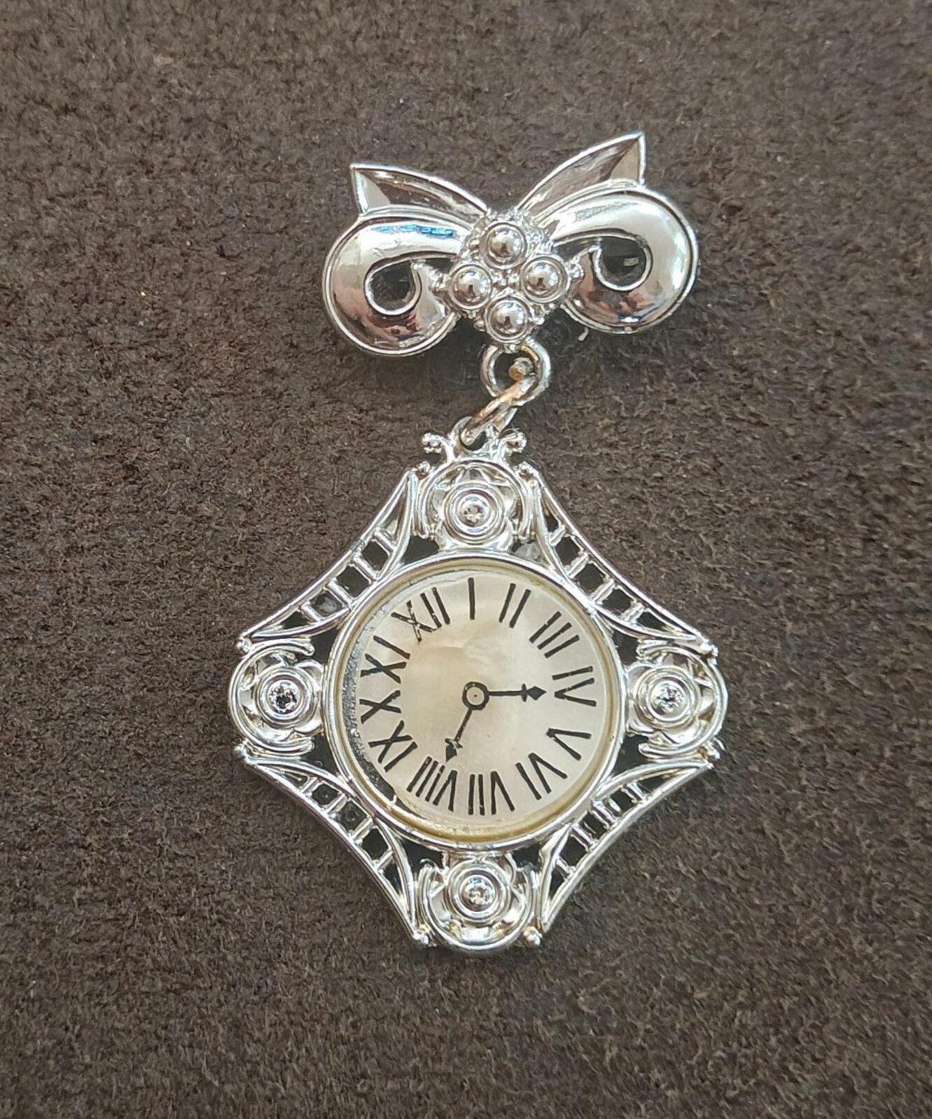 1980s Silver Tone Art Deco Style Bow Clock Motif Dangle Brooch