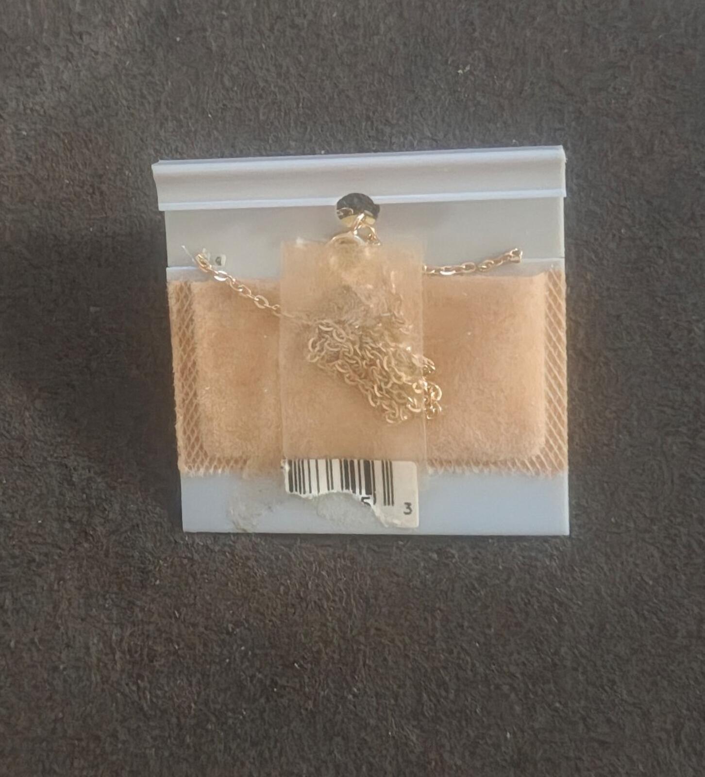 Gold-tone necklace chain with clasp, shown from the back