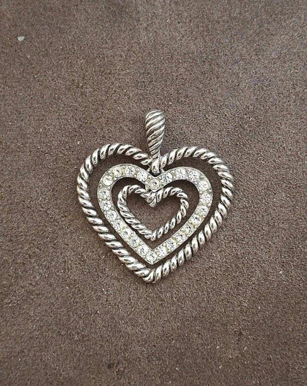 Silver heart pendant front view with rope border, loop bail, and rhinestone sparkle
