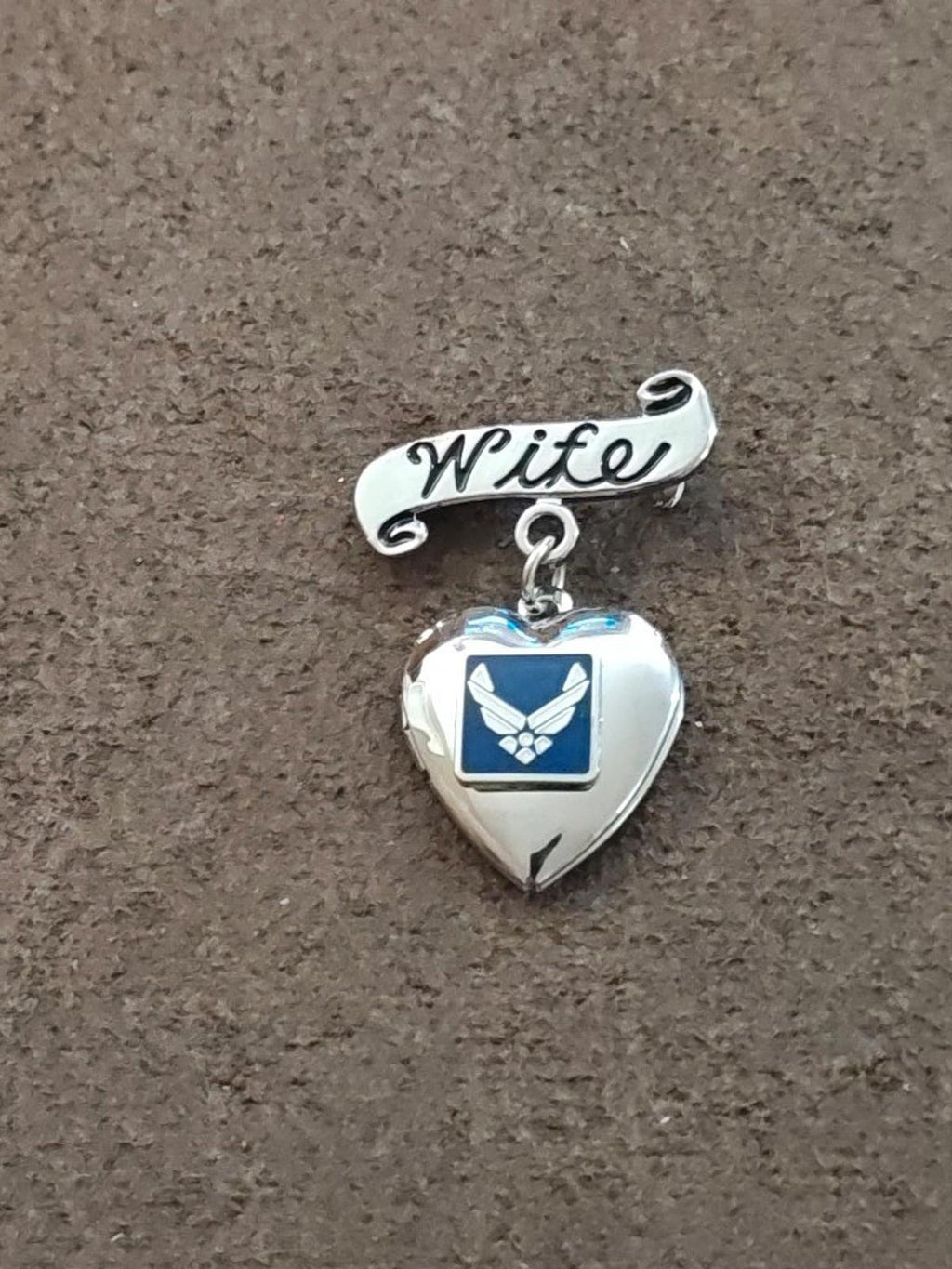 Silver-tone heart locket brooch with 'Wife' bar and blue/white enamel emblem dangle