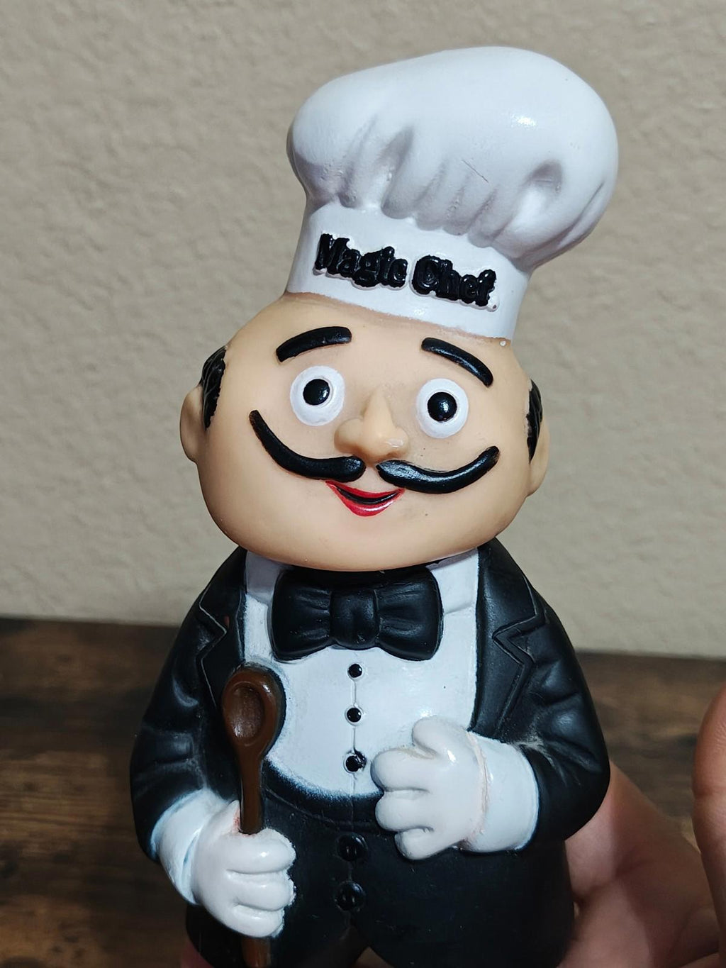 Black chef coin bank figurine, Magic Chef hat close-up