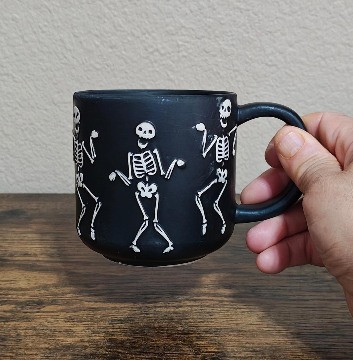 Dancing Skeletons Black Earthenware 13 oz 3D Embossed Black Mug.