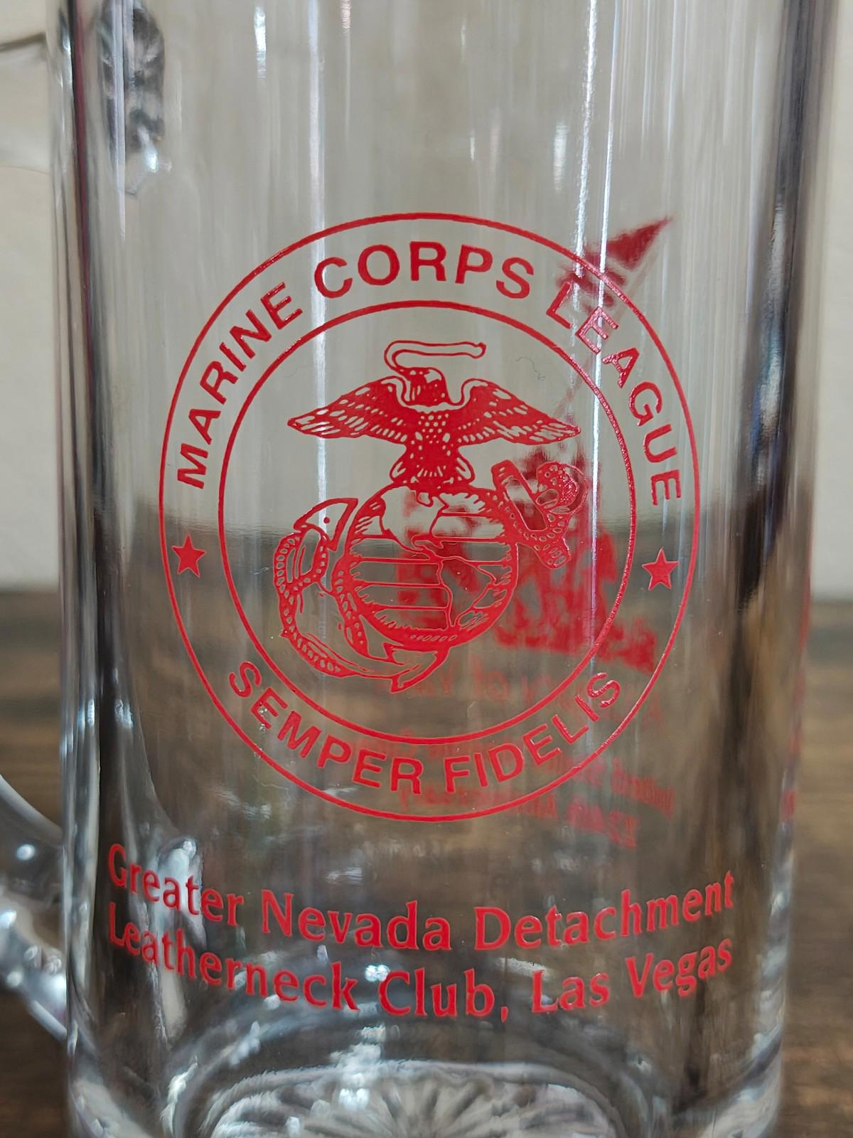 Clear beer mug close-up of red Marine Corps seal with club name text underneath