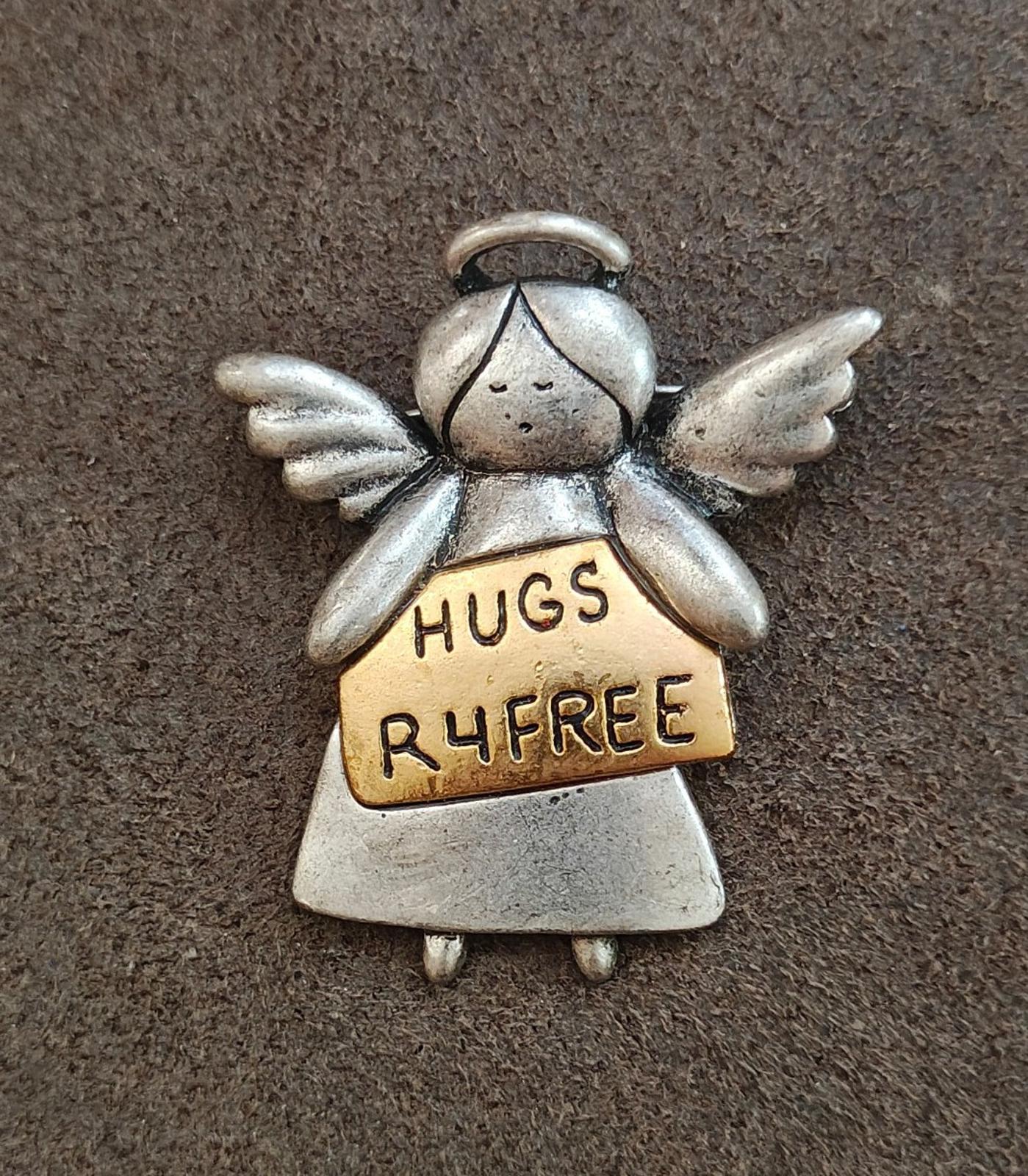 Silver angel brooch, winged charm with tan sign: HUGS R4FREE