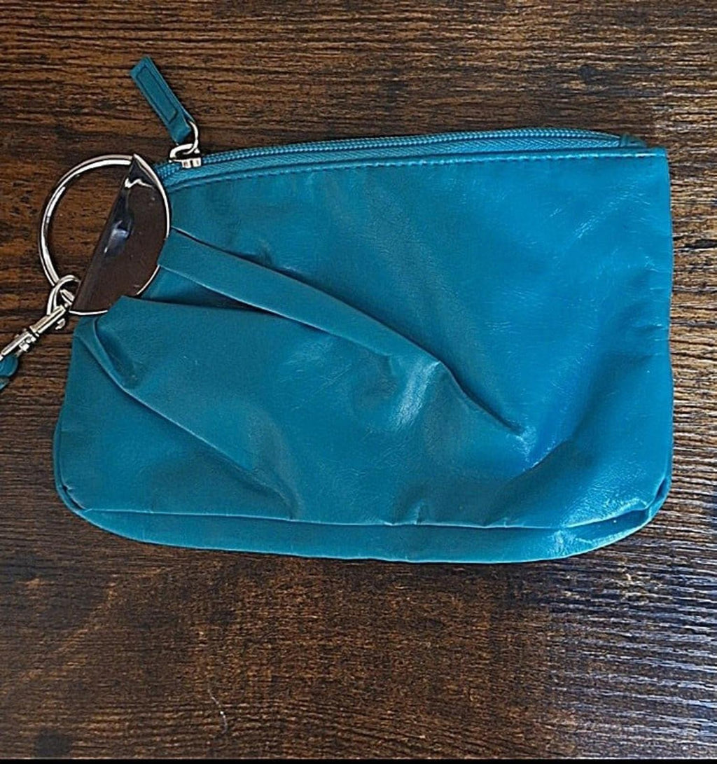 Teal PVC clutch purse with zipper and wrist strap, top view with hardware