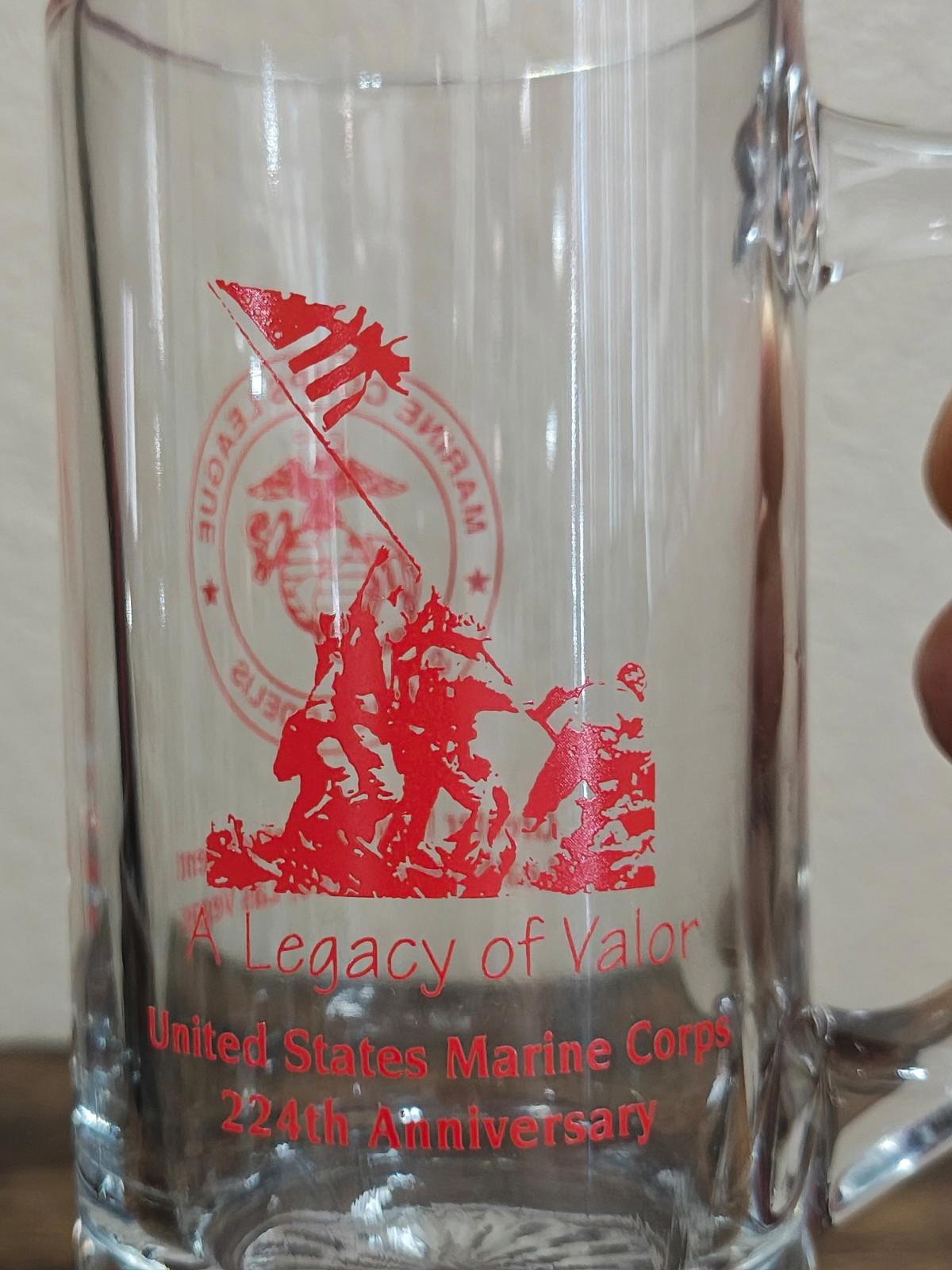 Clear beer mug close-up with red 'Legacy of Valor' and Marine Corps anniversary text