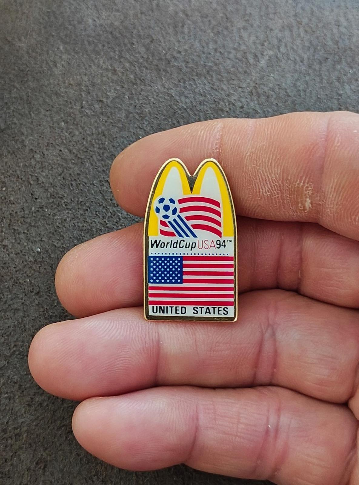 WorldCup USA '94 lapel pin in gold tone with McDonald's arch and U.S. flag stripes