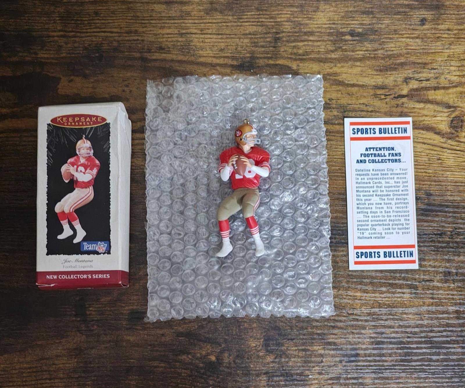 Football player ornament figure on bubble wrap with box and sports bulletin card