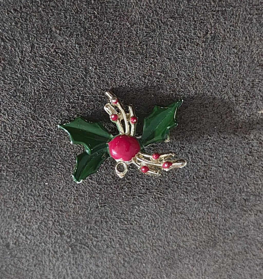 Holly enamel brooch pin with green leaves, red berry, and gold-tone prong and curl accents
