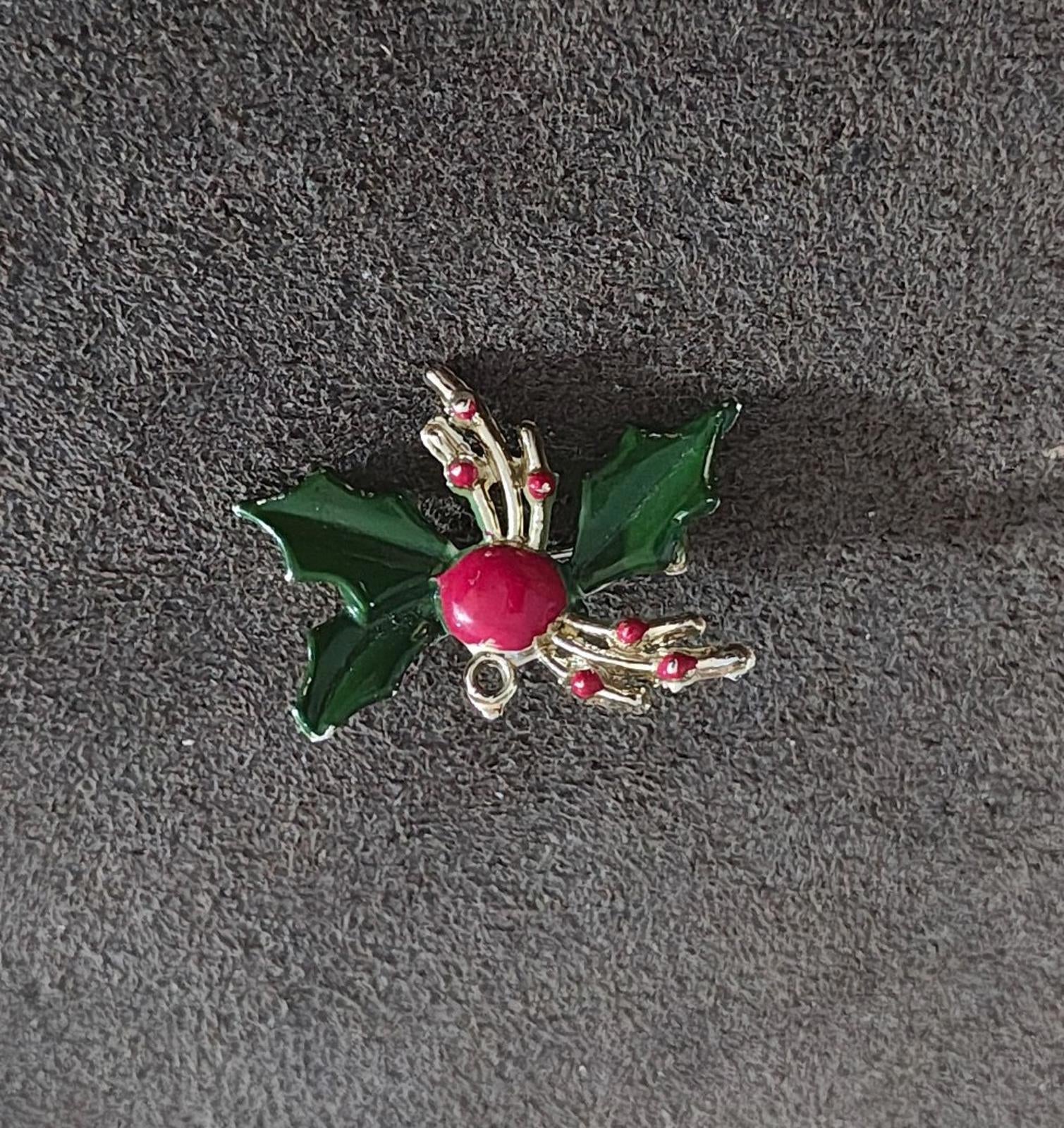 Holly enamel brooch pin with green leaves, red berry, and gold-tone prong and curl accents